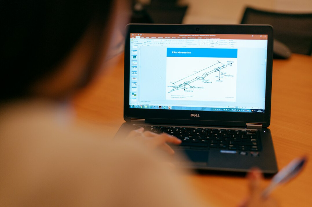 person using laptop for calculations